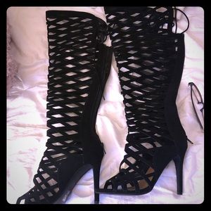 Black strapped over knee boots
